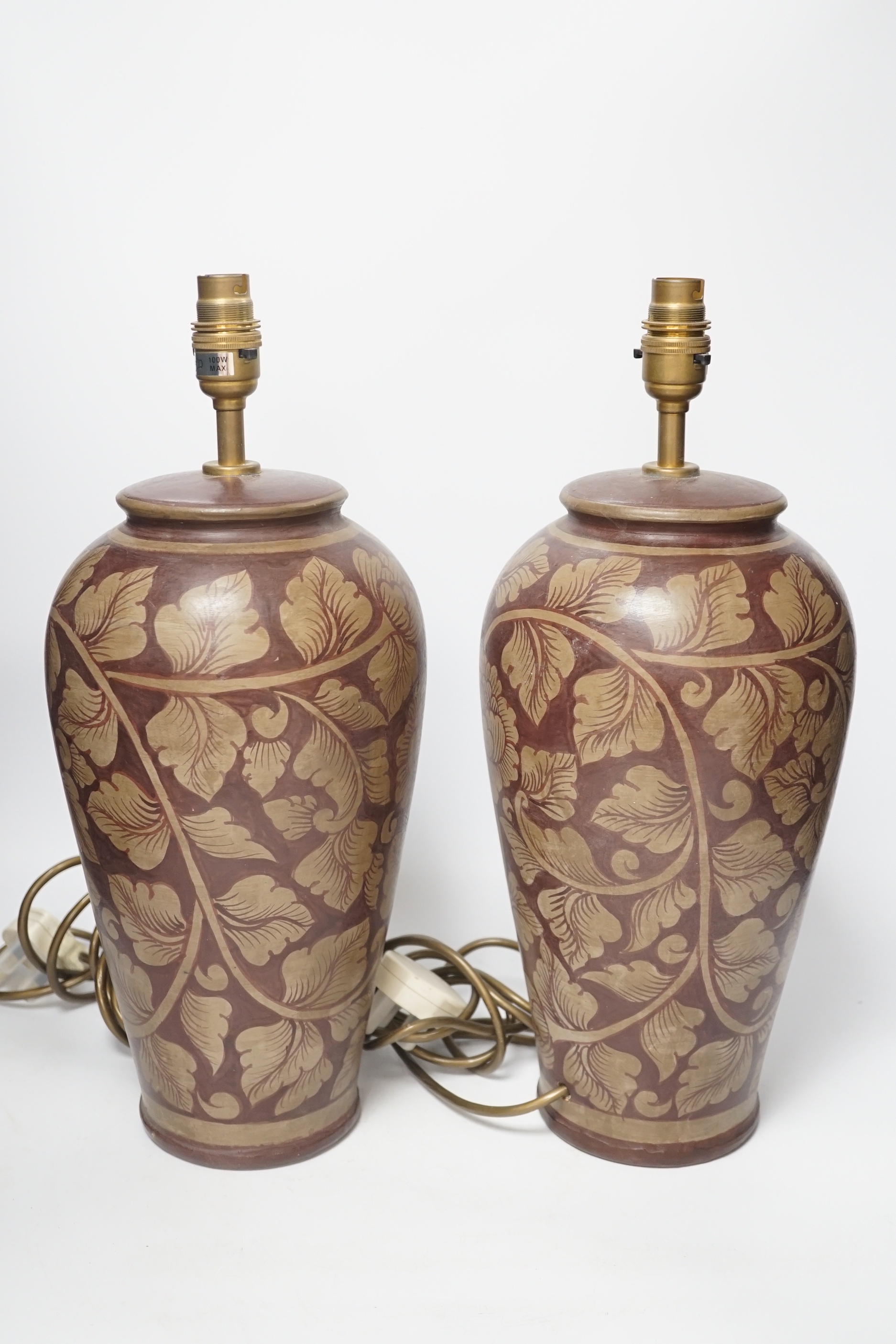 A pair of modern pottery floral designed lamps, total height 42cm